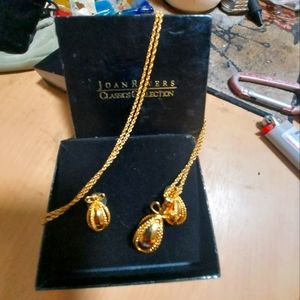 Joan River classic Egg necklace and earrings set in tack with original packaging